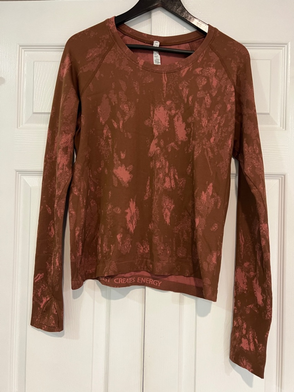 Lululemon long sleeve workout shirt. Rusty brown and pink pattern. Size 14.